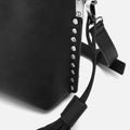Nibati bolso bandolera pequeño con detalles metálicos 